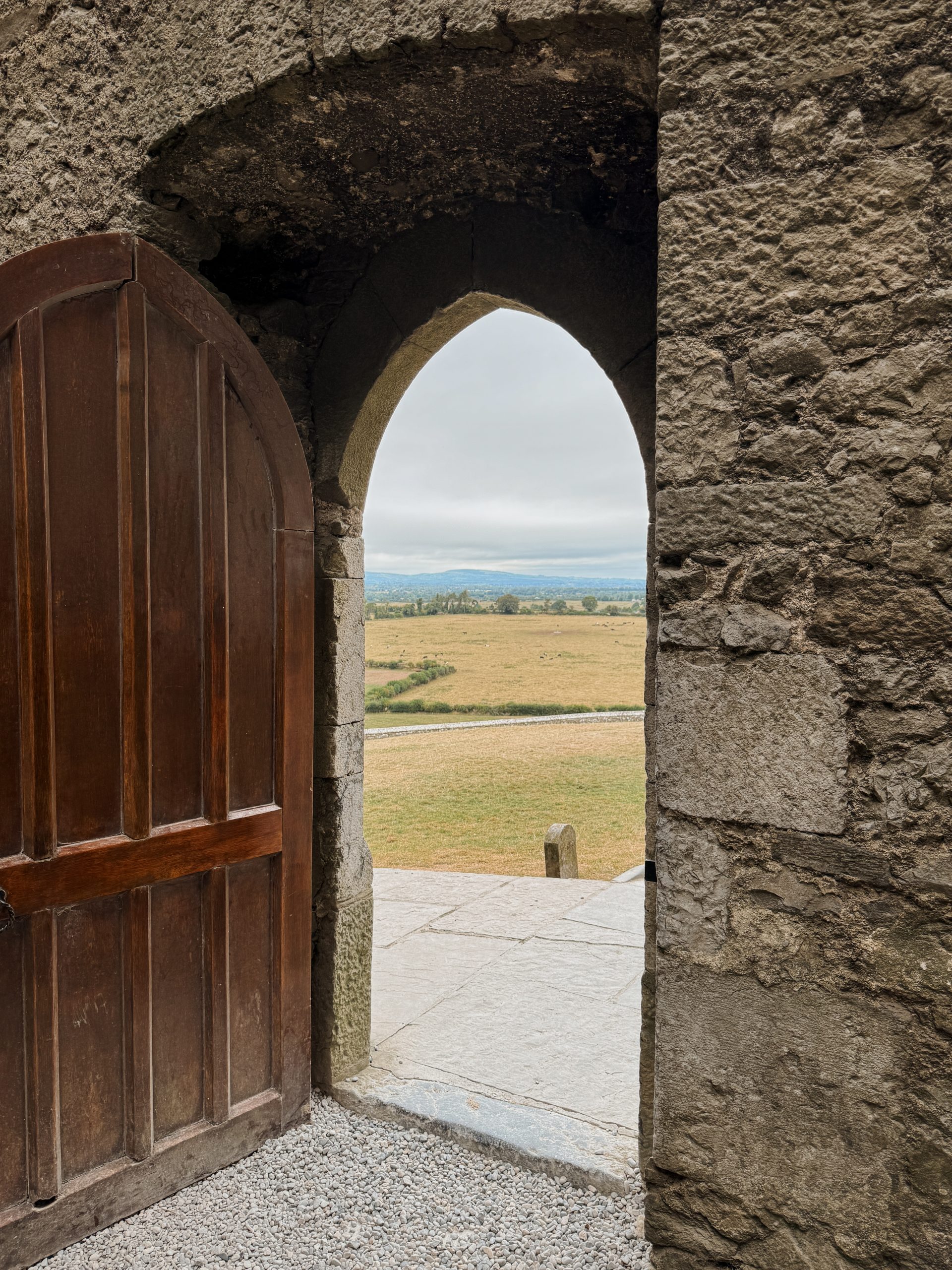 Open door in Rock of Cashel looking out at Irish Countryside in Tipperary, Ireland