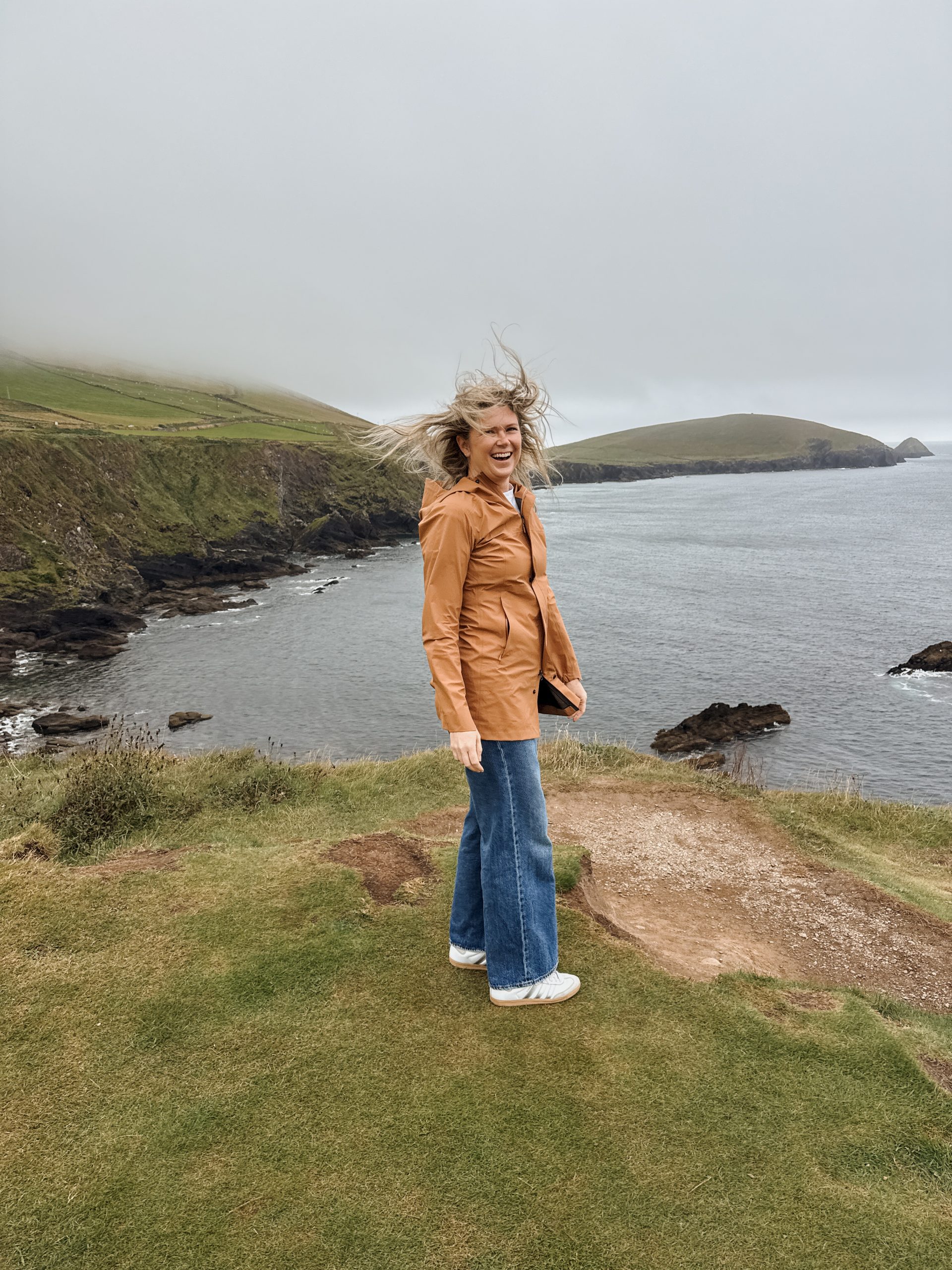 Woman at Dunquin Pier on Slea Head Drive in Ireland