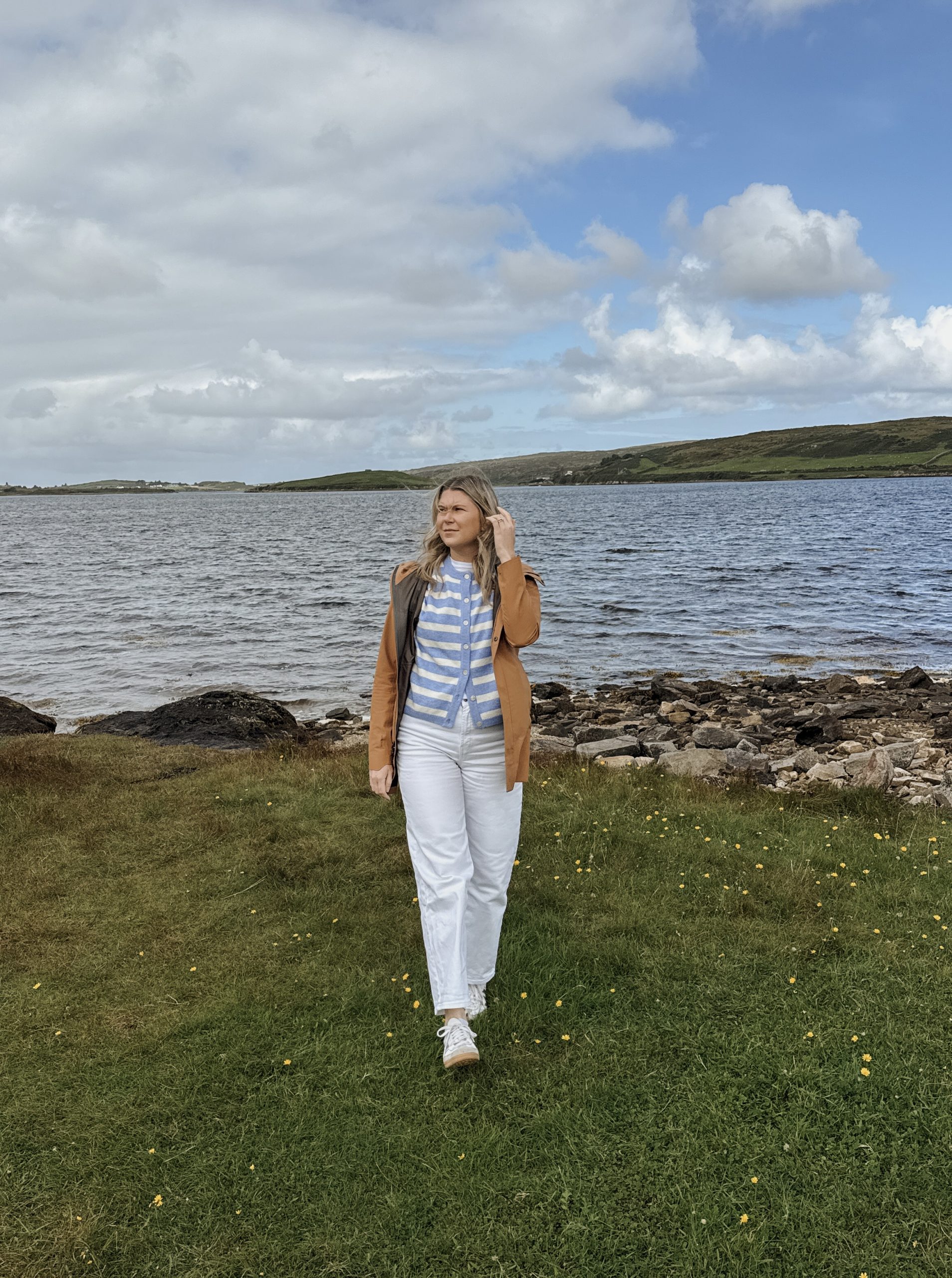 Woman walking at scenic spot on the Connemara Loop in Ireland