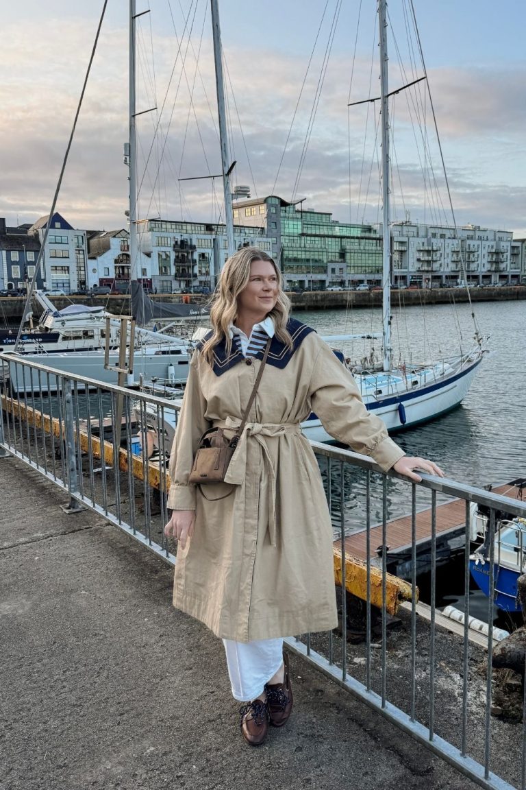 Woman standing at marina in Galway, Ireland