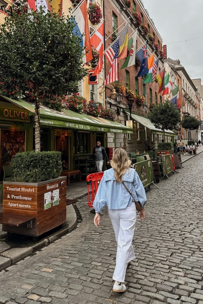 Woman walking in The Temple Bar area in Dublin, Ireland