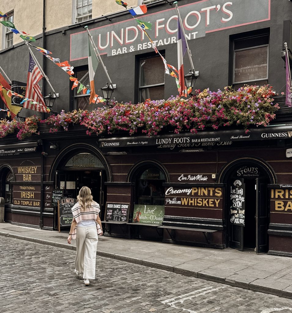 Woman walking to pub in Dublin, Ireland